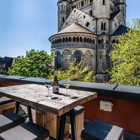 Eventlocation: Dachgarten Rheinloft Cologne - Blick auf die Kathedrale Groß St. Martin

 - Rheinloft Cologne